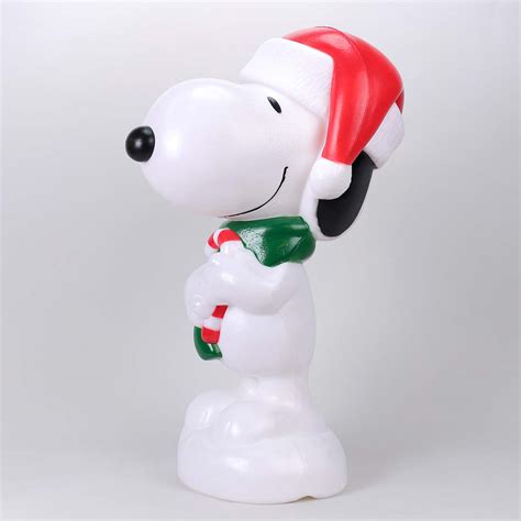 With a charming design of the Grinch dressed in a red Santa suit while holding a wreath, it'll surely bring some holiday magic to any space. . Blow mold snoopy